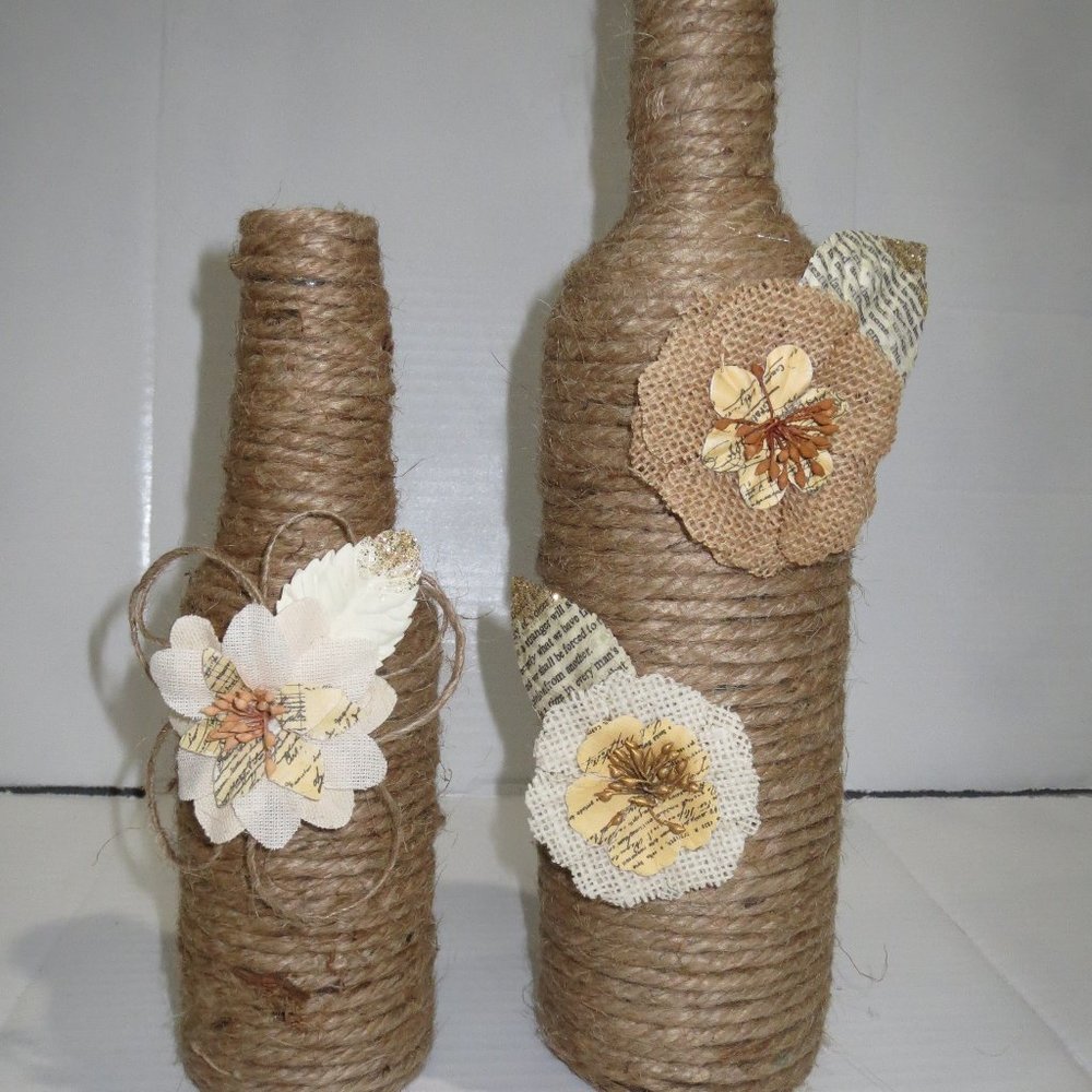 2 JUTE WRAPPED WINE BOTTLES/VASE. BURLAP FLOWERS.
